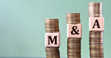 Image of coins with M and A notes
